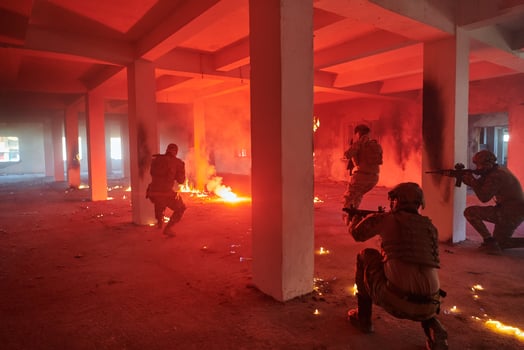 A group of professional soldiers bravely executes a dangerous rescue mission, surrounded by fire in a perilous building. photo