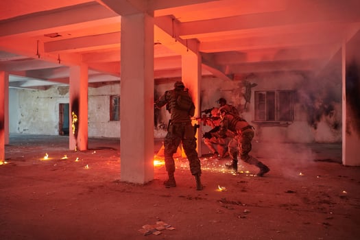 A group of professional soldiers bravely executes a dangerous rescue mission, surrounded by fire in a perilous building. photo
