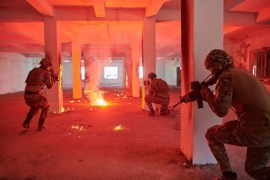 A group of professional soldiers bravely executes a dangerous rescue mission, surrounded by fire in a perilous building. photo