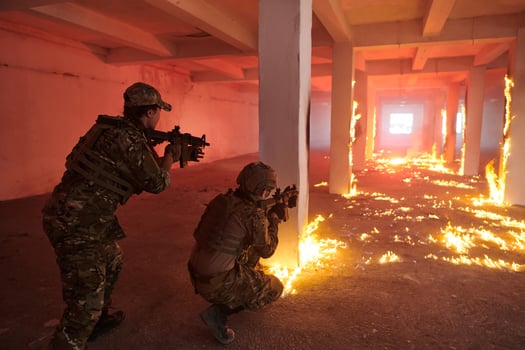 A group of professional soldiers bravely executes a dangerous rescue mission, surrounded by fire in a perilous building. photo
