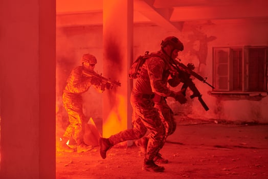 A group of professional soldiers bravely executes a dangerous rescue mission, surrounded by fire in a perilous building. photo