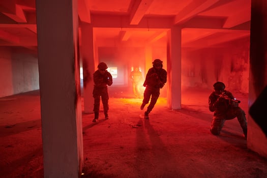 A group of professional soldiers bravely executes a dangerous rescue mission, surrounded by fire in a perilous building. photo