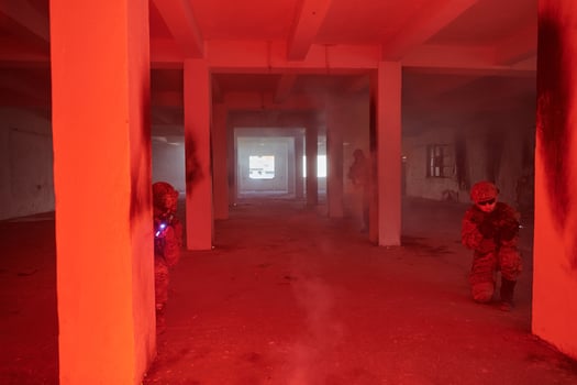 A group of professional soldiers bravely executes a dangerous rescue mission, surrounded by fire in a perilous building. photo