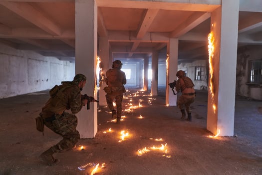 A group of professional soldiers bravely executes a dangerous rescue mission, surrounded by fire in a perilous building. photo