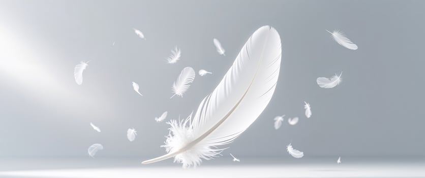 A luminous white feather surrounded by multiple smaller floating feathers. photo