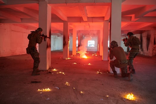 A group of professional soldiers bravely executes a dangerous rescue mission, surrounded by fire in a perilous building. photo