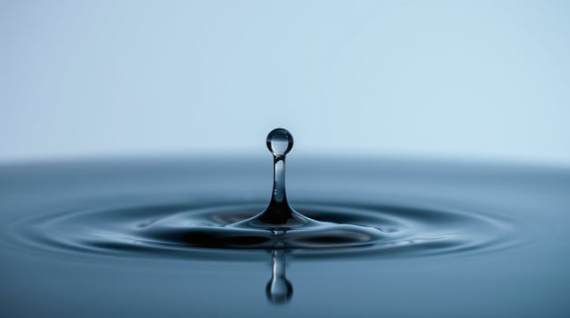 Water drops on a smooth surface with ripples and waves. photo