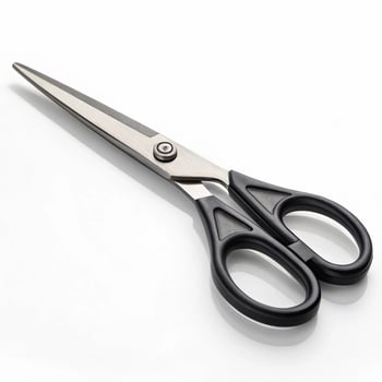 A pair of black scissors on a white surface photo