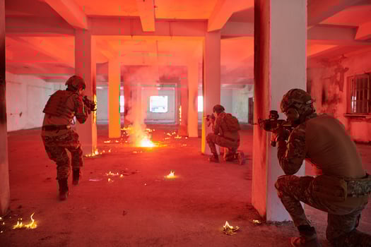 A group of professional soldiers bravely executes a dangerous rescue mission, surrounded by fire in a perilous building. photo