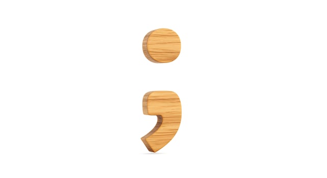 Wooden Semicolon Punctuation Mark Cutout on White Background photo