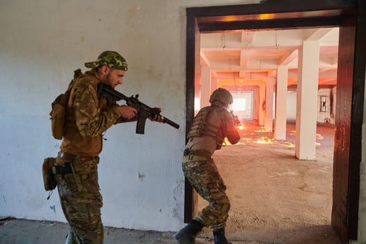 A group of professional soldiers bravely executes a dangerous rescue mission, surrounded by fire in a perilous building. photo
