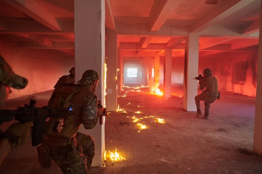 A group of professional soldiers bravely executes a dangerous rescue mission, surrounded by fire in a perilous building. photo
