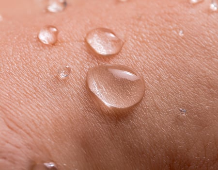 Transparent Collagen Drops on Hand Skincare Concept photo