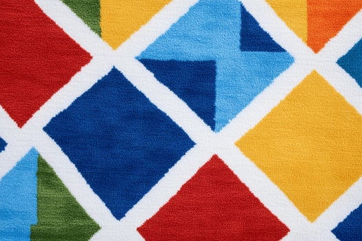 A colorful rug with a diamond pattern photo