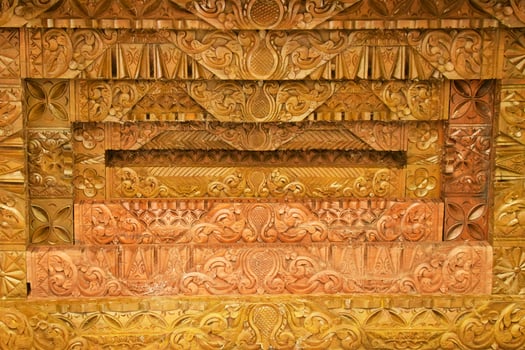 Authentic Javanese Wood Carvings on Joglo Pavilion Roof photo