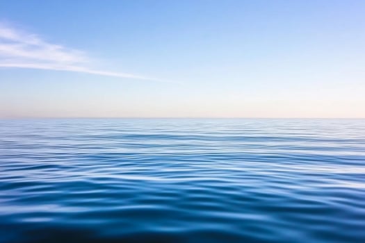 A blue ocean with a white sky in the background photo