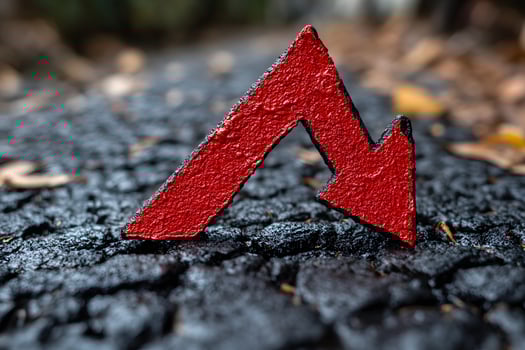 Red Downward Arrow on Cracked Asphalt Economic Decline Concept photo