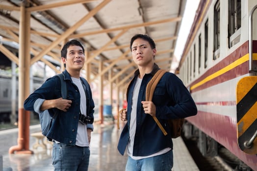 Curious Travelers at the Train Station. Two young adventurers looking towards their awaiting train. photo