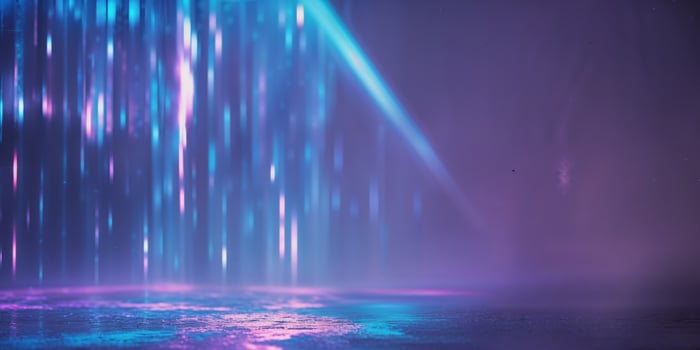 A purple and blue light is shining through the water photo