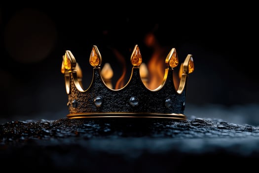 Majestic crown emerging from flames symbolizing power and royalty photo