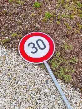 30 kmh Speed Limit Sign on Ground, Urban Environment, Road Safety, Transportation, Regulations. High quality photo