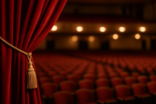 Red Velvet Curtain Opens to Reveal Empty Theater Seats at Evening Show photo