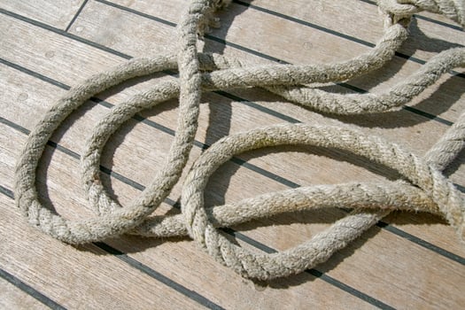 Rope laying on a ship deck photo