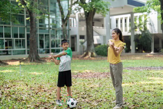 Fitness and Stretching. A girl and a boy warm up by stretching in a park. photo