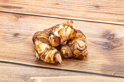 A close up of a ginger root on a wooden table photo