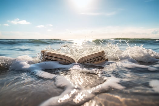 An open book lying on the beach with waves photo