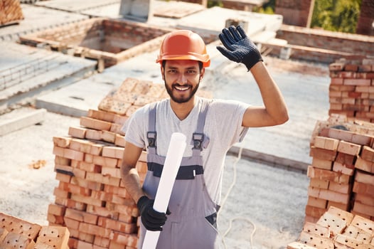 Holding, th,e document. Handsome Indian man is on the construction site photo