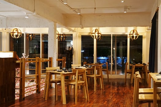 Interior design and dining decoration of local Japanese Sukiyaki restaurant decorated with wooden furniture in Japanese style photo