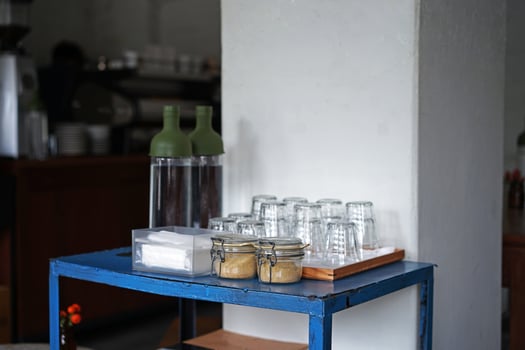 Interior corner design and bar decoration of local coffee bar and bakery pastry shop decorated with wooden furniture in minimal style photo