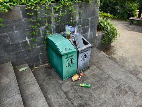 Green and Gray Trash Bins for Organic and Non-Organic Waste Management in Urban Parks. photo