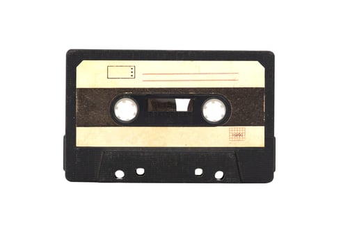 The black vintage Compact Audio Cassette isolated on white background. photo
