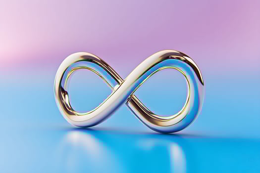 Stylish golden infinity symbol on a colorful gradient background representing limitless potential and eternity photo