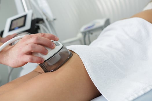 Vacuum massage treatment for cellulite reduction in professional beauty and wellness center. photo