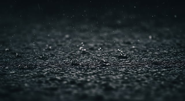 Raindrops on black asphalt photo