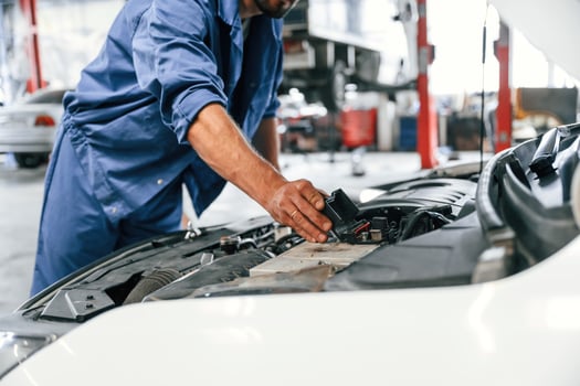 Troubleshooting process. Auto, mechanic working in garage. Repair service photo