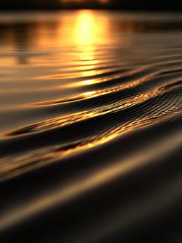 Sunset on the water with ripples photo