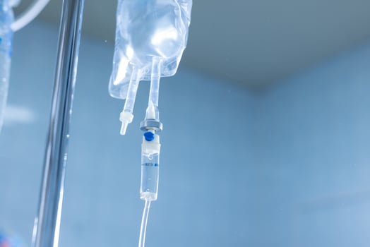 Intravenous drip system in medical environment, concept of hospital care and fluid therapy. photo