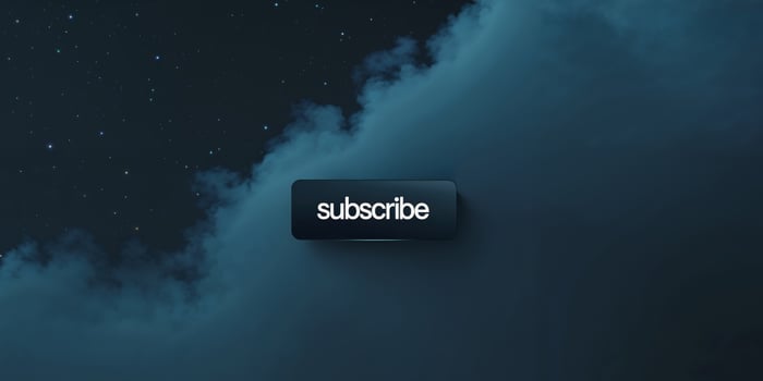 A dark sky backdrop features a subscribe button with white lettering. photo