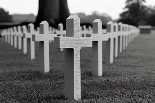 A black and white photo of a cemetery with crosses