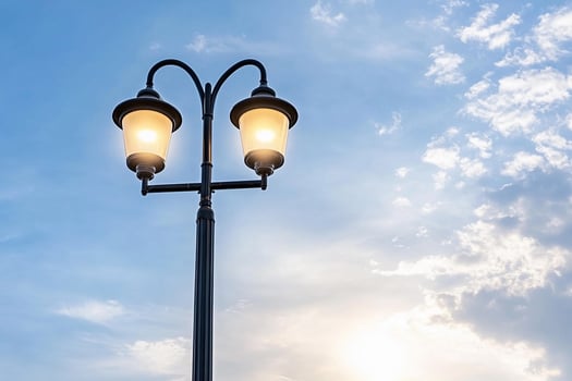 Street light with blue sky and clouds photo