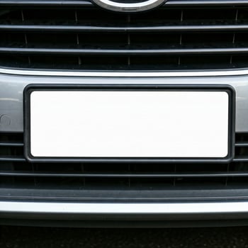 Mock plain white license plate on a car bumper photo