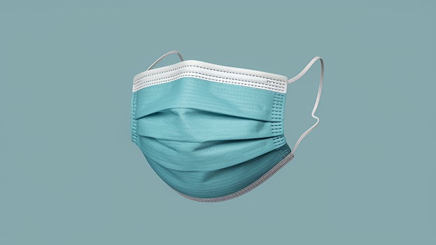 Protective teal face mask essential safety gear detailed view soft lighting clean background photo