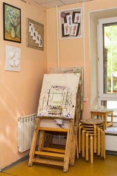 29.05.21 Moskow. art school. A painting is leaning against a wall in a room with a window photo
