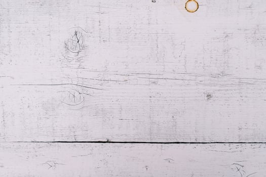 White wooden background with scratches and rust spots photo