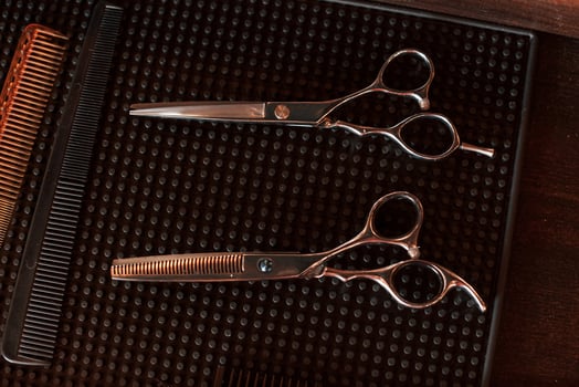Top close up view of barber scissors that are lying down photo
