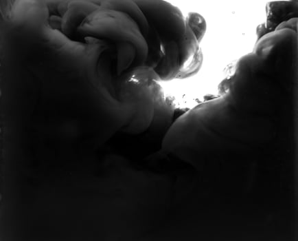 A black and white photo of a person in the water